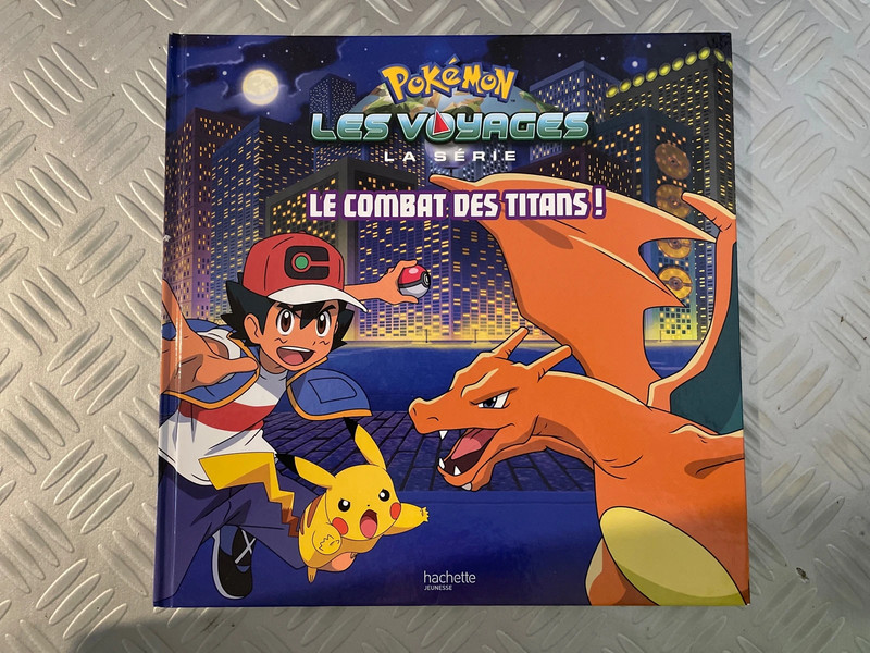 Livre Pokémon les voyages la série le combat des titans
